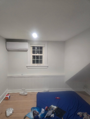 Finished room with clean white walls and wainscoting